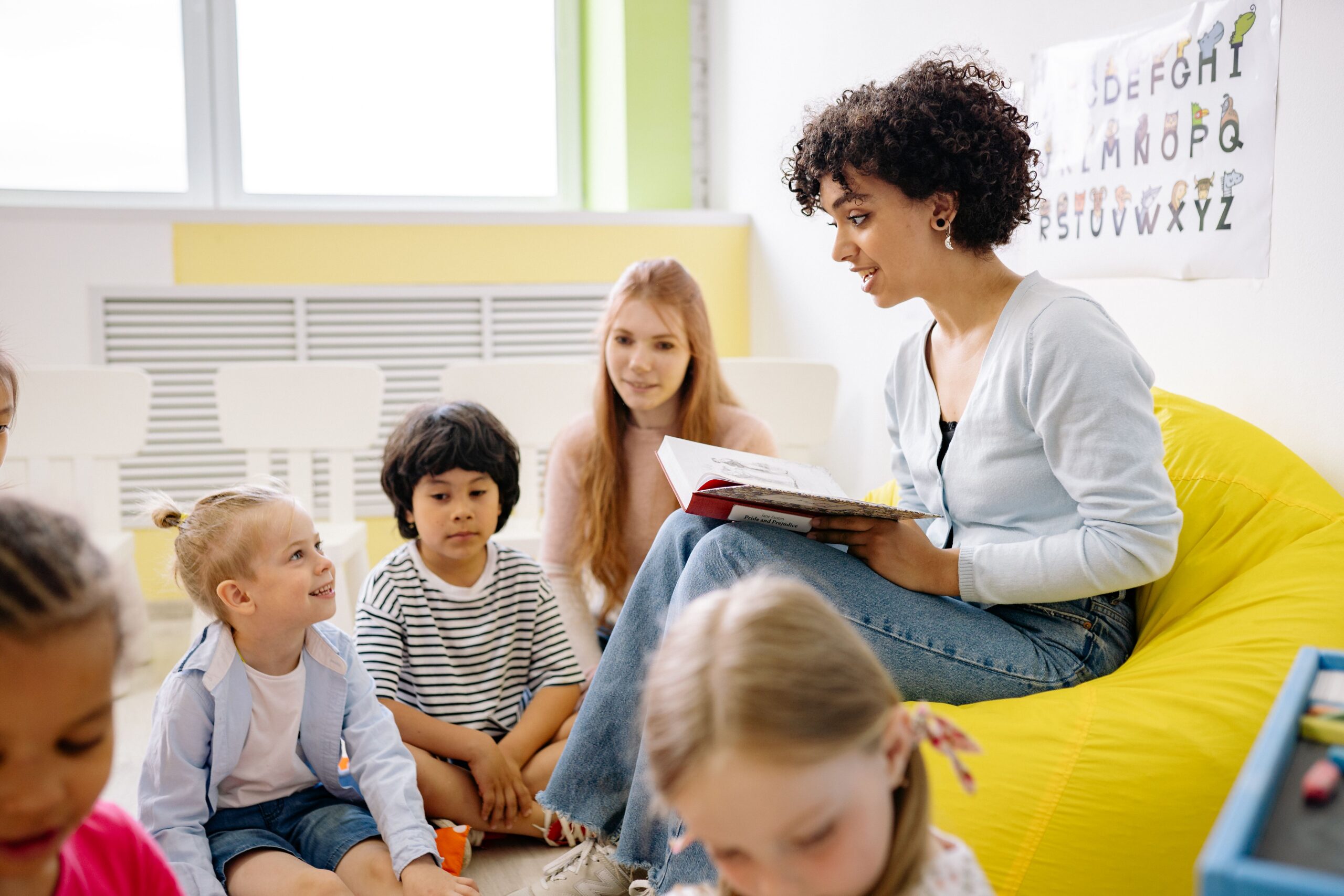 Therapist supporting a child during a learning activity