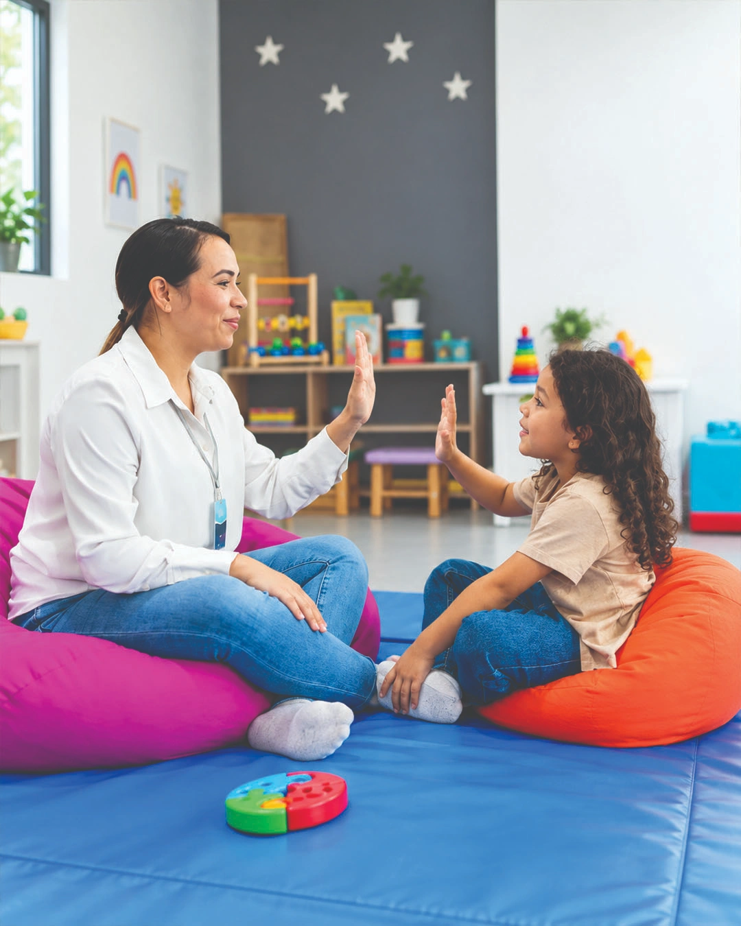 Therapist supporting a child during a learning activity